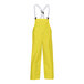Yellow Tingley Webdri overalls with suspenders and a snap fly.