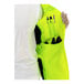 A person holding a Tingley lime yellow mesh safety vest with pockets.