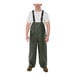 A man wearing Tingley green rain overalls.