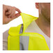 A man adjusting the Tingley Job Sight hi-vis yellow mesh safety vest.