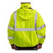 A person wearing a Tingley hi-vis yellow and black industrial work jacket.