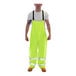 A man wearing Tingley Vision Class E hi-vis lime overalls.