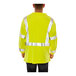 A man wearing a Tingley hi-vis lime yellow flame-resistant long sleeve shirt.