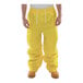 A person wearing yellow Tingley DuraScrim pants.