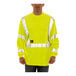 A man wearing a Tingley lime yellow flame-resistant safety shirt.