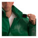 A man wearing a Tingley SafetyFlex green jacket with elastic sleeve cuffs.