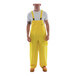A man wearing yellow Tingley overalls.