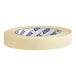 A roll of Lavex masking tape with blue text on it.