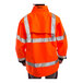 An orange Tingley Icon Hi-Vis jacket with black panels and reflective stripes on a person.