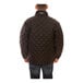 A man wearing a Tingley black quilted insulated jacket.