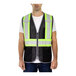 A man wearing a Tingley hi-vis safety vest with reflective stripes.