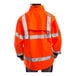 An orange Tingley Icon Class 3 jacket with black panels and reflective stripes on a person.