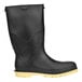 A black rubber Tingley StormTracks youth rain boot with a yellow sole.