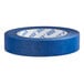 A close-up of a roll of Lavex blue masking tape with the word "tape" on a card.