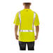 A man wearing a yellow Tingley Job Sight safety shirt with black front panel and reflective stripes.