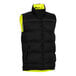 A Tingley black and yellow reversible insulated vest with reflective lining.