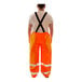 Tingley Icon orange and black overalls with black suspenders.