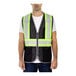 A man wearing a Tingley hi-vis black mesh safety vest with reflective stripes.
