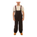 A man wearing Tingley Icon black overalls.