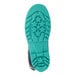 The blue sole of a Tingley StormTracks youth rain boot with green stars.
