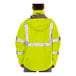 A man wearing a Tingley yellow and black safety jacket.
