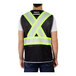 A man wearing a Tingley hi-vis black mesh safety vest with reflective tape.