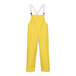 A pair of yellow Tingley Magnaprene overalls with suspenders.