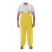 A man wearing yellow Tingley Magnaprene overalls.