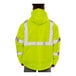 A person wearing a Tingley hi-vis yellow and black pullover jacket.