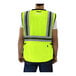 A man wearing a Tingley high visibility yellow mesh safety vest.