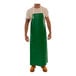 A man wearing a green Tingley SafetyFlex dishwashing apron.