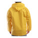 The back of a person wearing a Tingley yellow rain jacket.