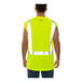 A man wearing a Tingley hi-vis lime sleeveless shirt over a yellow safety vest.