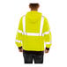 A person wearing a Tingley lime yellow flame-resistant sweatshirt.