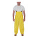 A man wearing yellow Tingley Webdri overalls.