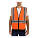 A man wearing a Tingley hi-vis orange safety vest with reflective stripes.