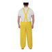 A man wearing yellow Tingley Industrial Work rain overalls.