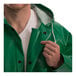 A man wearing a green Tingley SafetyFlex jacket with a hood.
