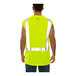 A man wearing a Tingley lime green sleeveless shirt over a yellow safety vest.