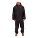 A man wearing a navy Tingley Tuff-Enuff Plus rainsuit.