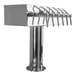 A Micro Matic polished stainless steel "T" style tap tower with four spouts.