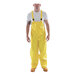 A man wearing Tingley yellow overalls.