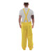 A man wearing yellow Tingley DuraScrim overalls with a snap fly.