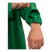 A person wearing a green Tingley SafetyFlex jacket with elastic sleeve cuffs.