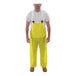 A man wearing yellow Tingley Eagle overalls.