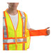 A man wearing a Tingley hi-vis lime safety vest with reflective stripes.