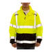 A man wearing a Tingley hi-vis lime and black safety jacket.