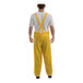 A person wearing a Tingley yellow rainsuit.