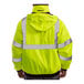 A man wearing a Tingley Bomber 3.1 Hi-Vis Lime Jacket with black panels.