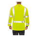 A man wearing a Tingley Hi-Vis lime yellow safety shirt with black panel.